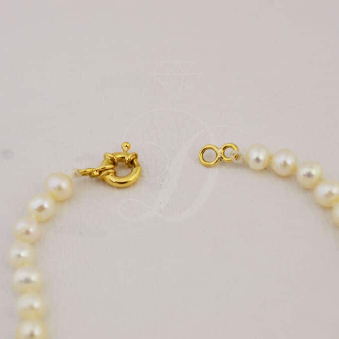 pulsera de perlas con oro